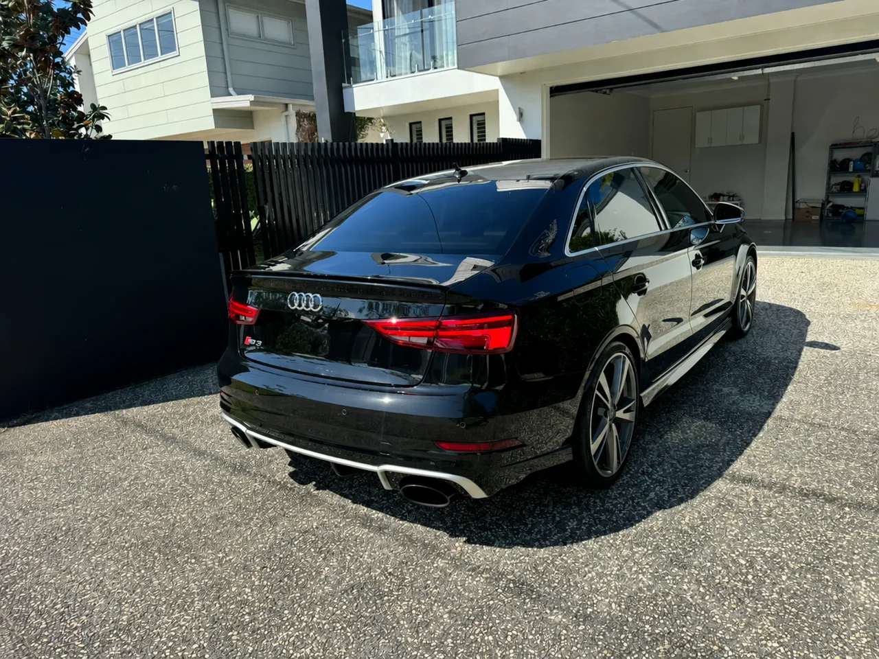 Rear three-quarter view of the black Audi RS3